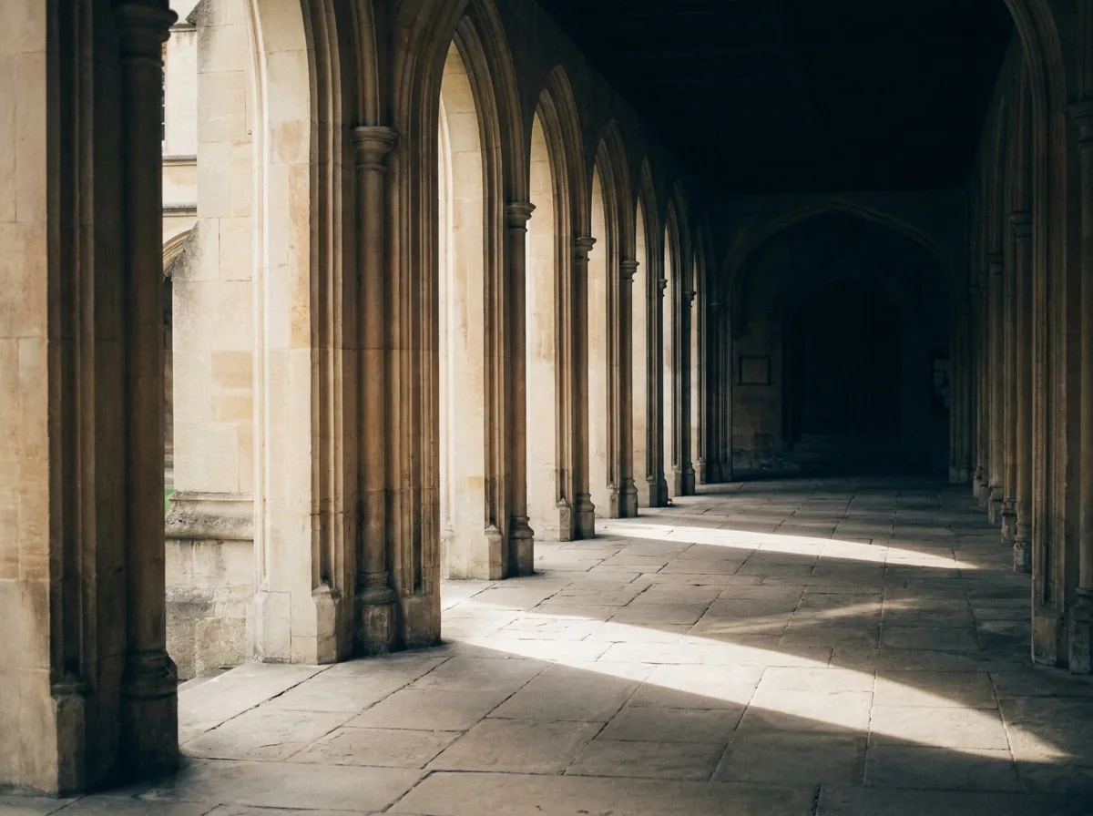 An arcade of columns opening onto a sunlit courtyard